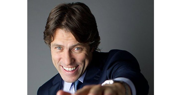 It might be a bit of a wait, but John Bishop will be coming to Cheltenham Racecourse in February 2022.